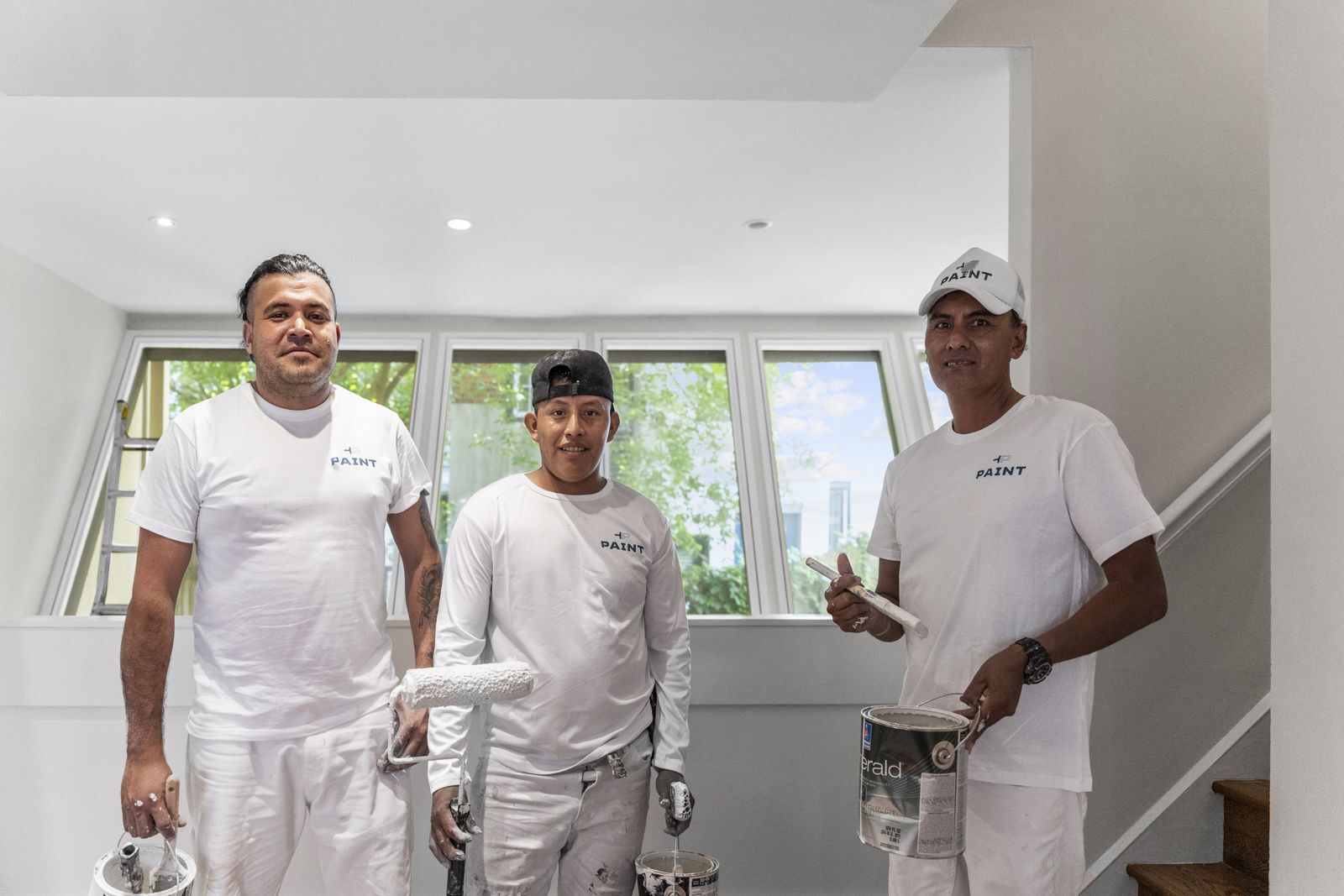 Three PAINT painters in a freshly painted room