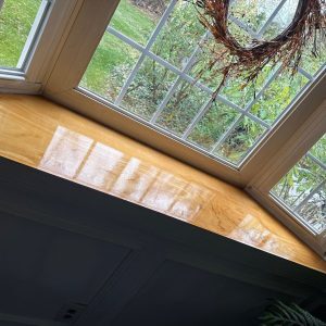 Custom carpentry and trim repair on a bay window in a Blue Bell, PA home by PAINT Philadelphia
